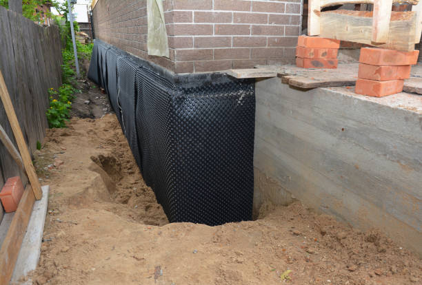 Happy homeowners after waterproofing job in Woodbine